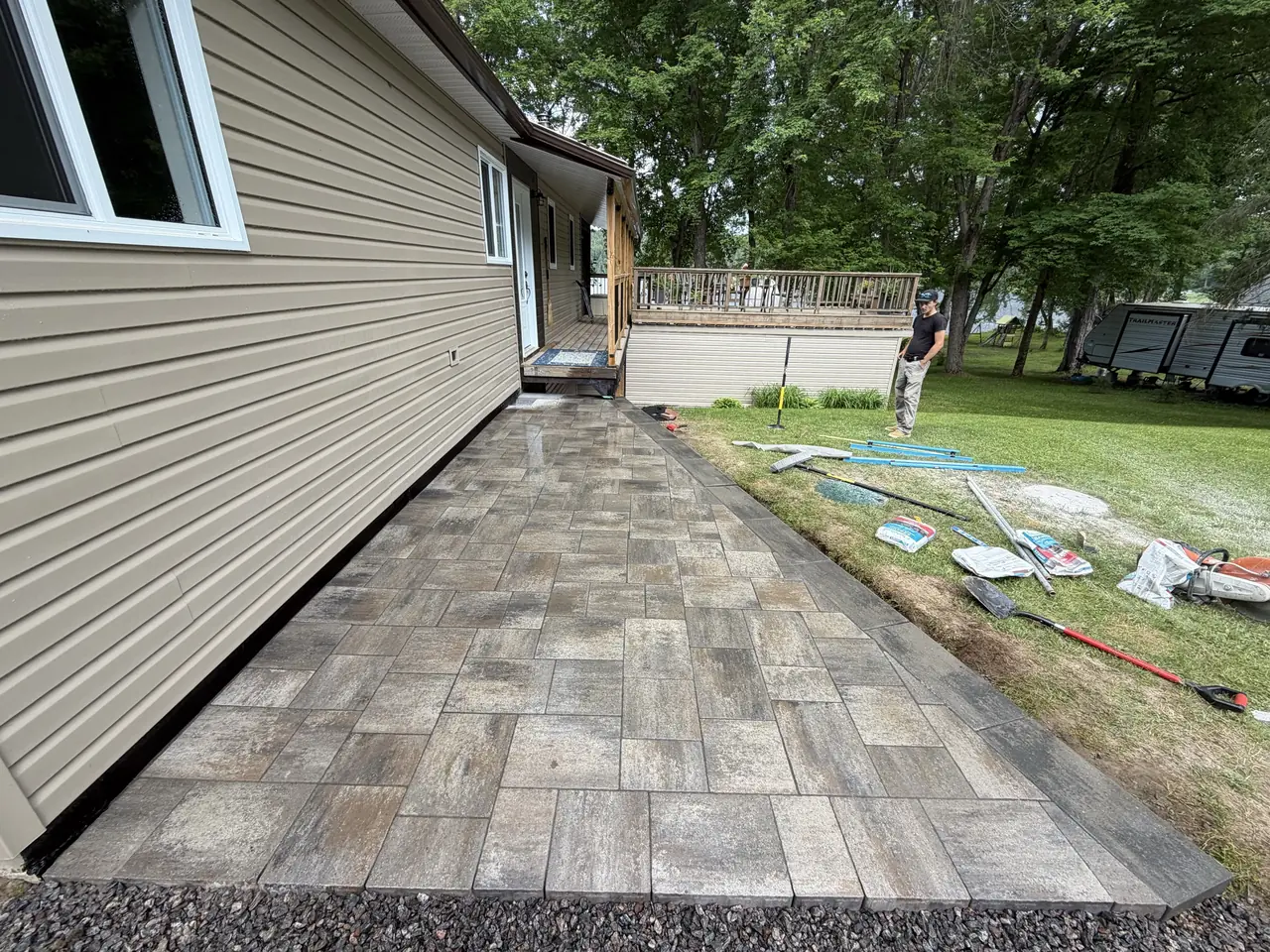 Exterior build and paver walkway along a home by Edwards Landscape and Construction in North Bay