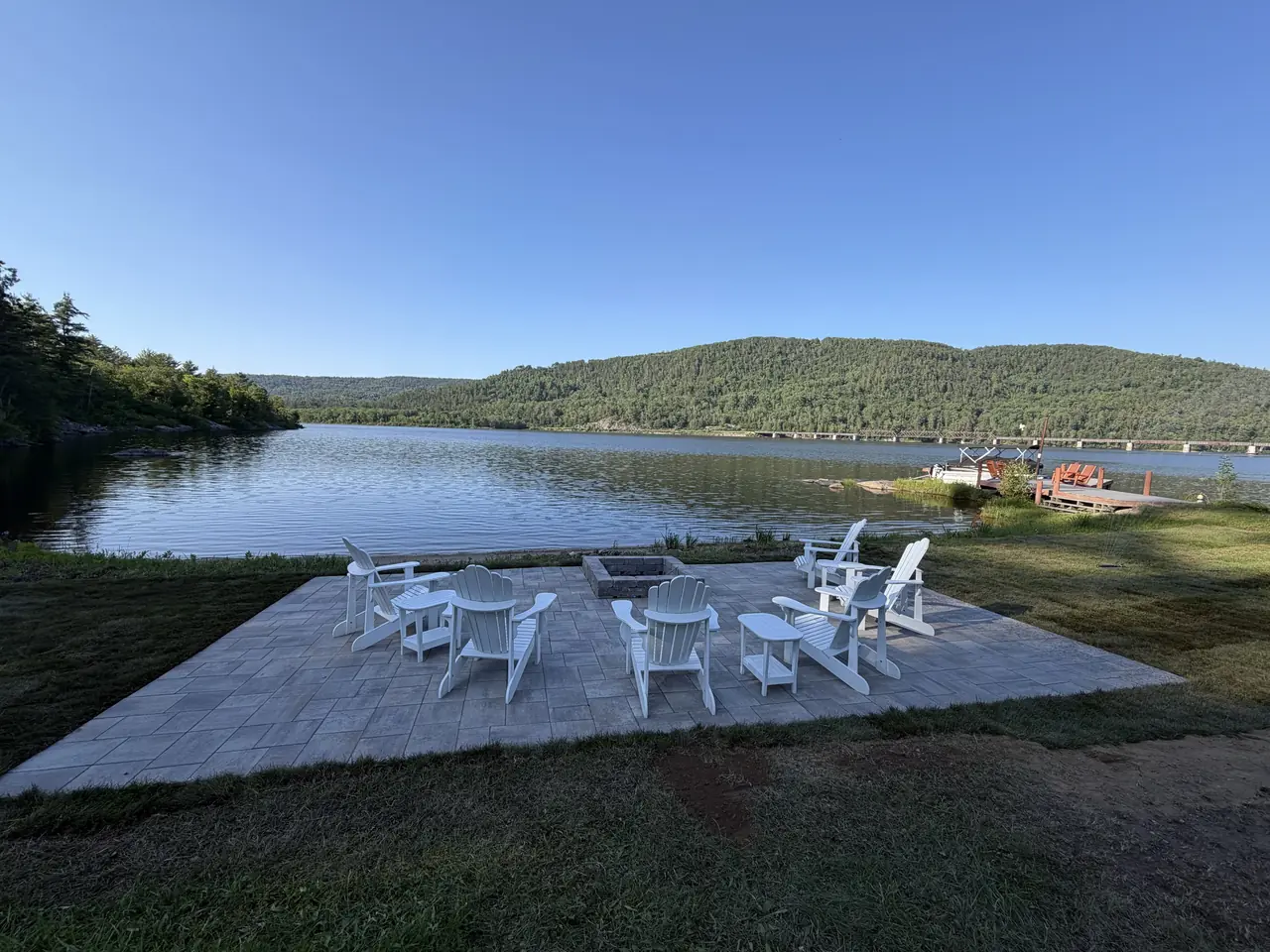 Waterfront patio and seating area built by Edwards Landscape and Construction near North Bay