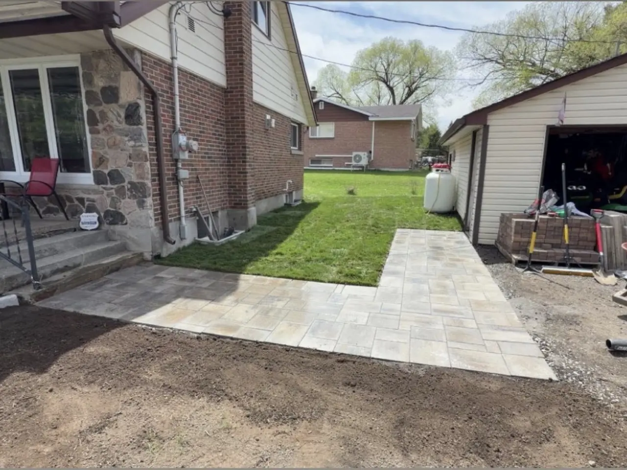 Compacted granular base and grading beside a home by Edwards Landscape and Construction in North Bay