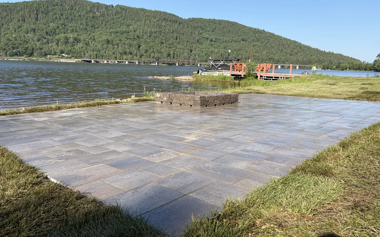 Large waterfront interlock paver patio built by Edwards Landscape and Construction near North Bay, Ontario