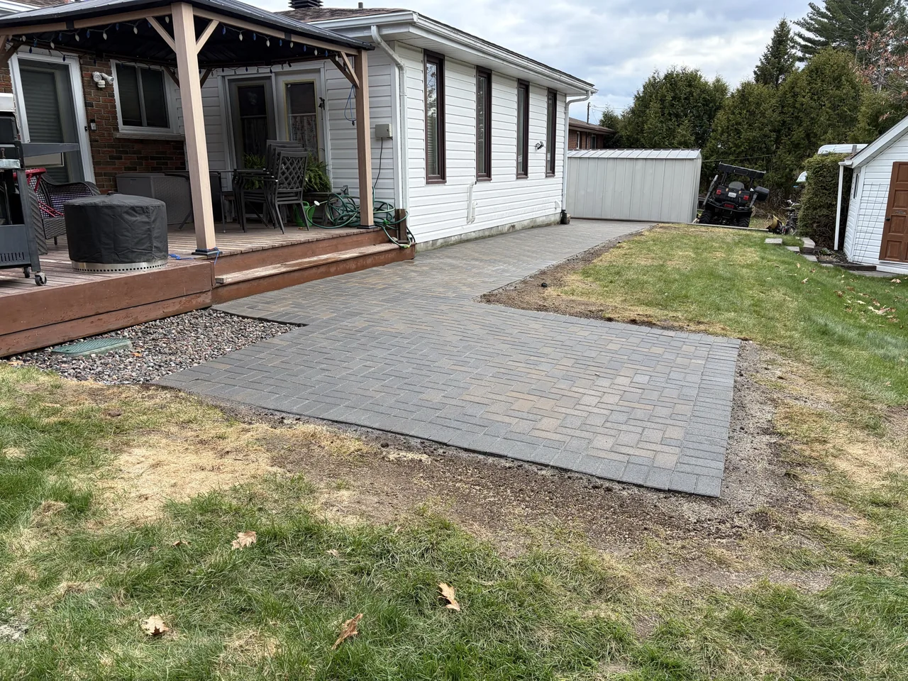 Backyard paver patio with pergola built by Edwards Landscape and Construction in North Bay