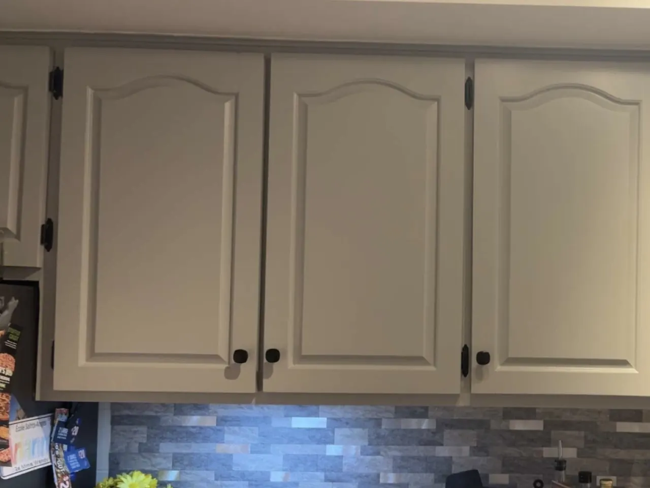 Kitchen cabinets refinished in white by Edwards Landscape and Construction in North Bay