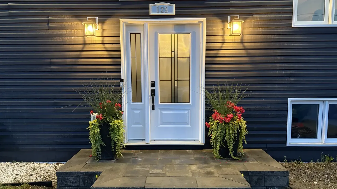 Edwards Landscape and Construction stone entrance steps and planters on a Northern Ontario home