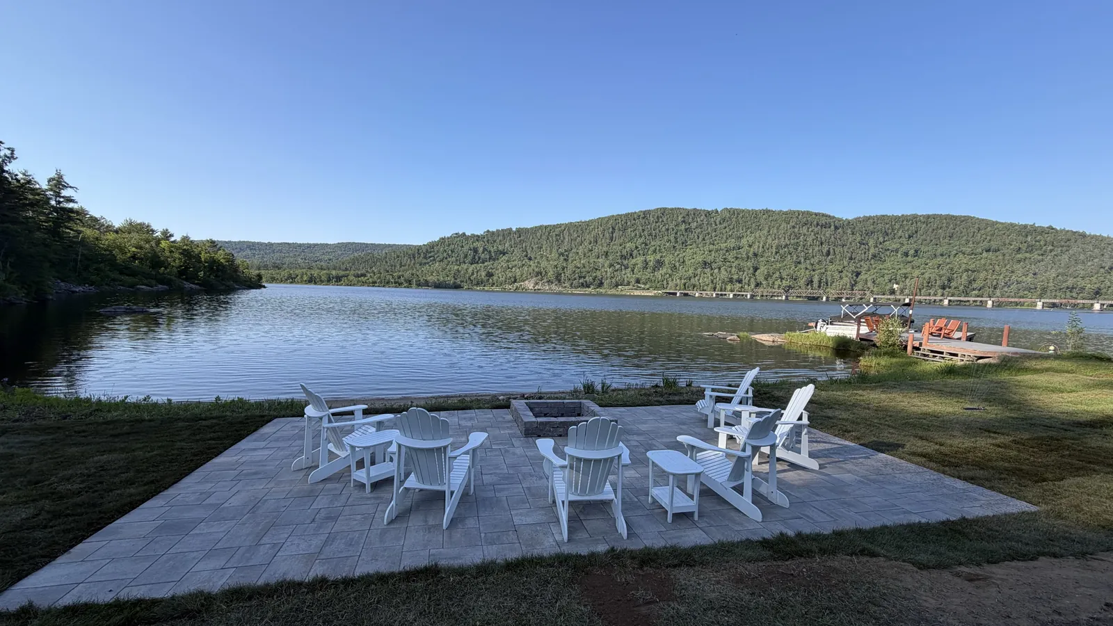 Lakeside outdoor living space with seating built by Edwards Landscape and Construction